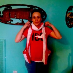 Crocheted scarf with two pockets for your hands phone or beer at the games